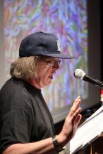 bill bissett performing his poem "embrace" at a Grey Borders Reading Series event in 2011 (Photo Credit: Barsin Aghajan)