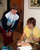 Maureen Jennings signs a copy of Let Loose the Dogs